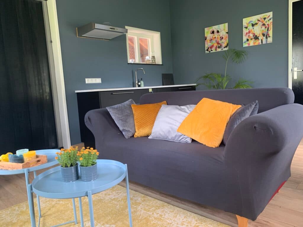 Bright kitchen-living area with comfortable seating and cooking facilities